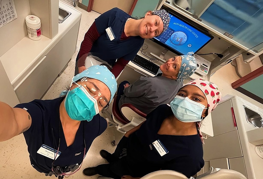 A group of dental hygienists smiling for the camera.