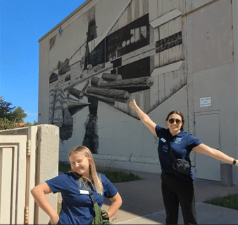 Two women posing and smiling for the camera.
