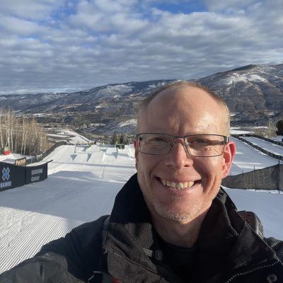 Ian McLeod takes a picture on a snowy slope.