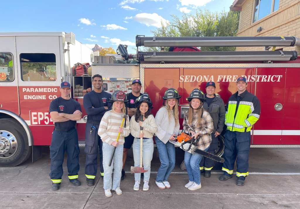 Sierra Guenther and other N A U Health students pose after meeting with Sedona's fire department.