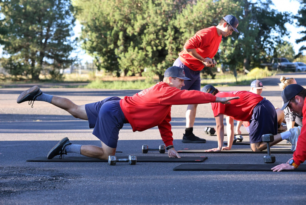 Bryce Winter, Greater Flagstaff Region Fire Academy recruit, completes an exercise during an athletic training program session at the Flagstaff Fire Department training tower.