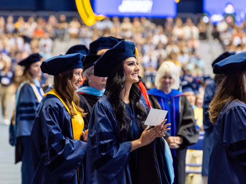 Graduates smiling.