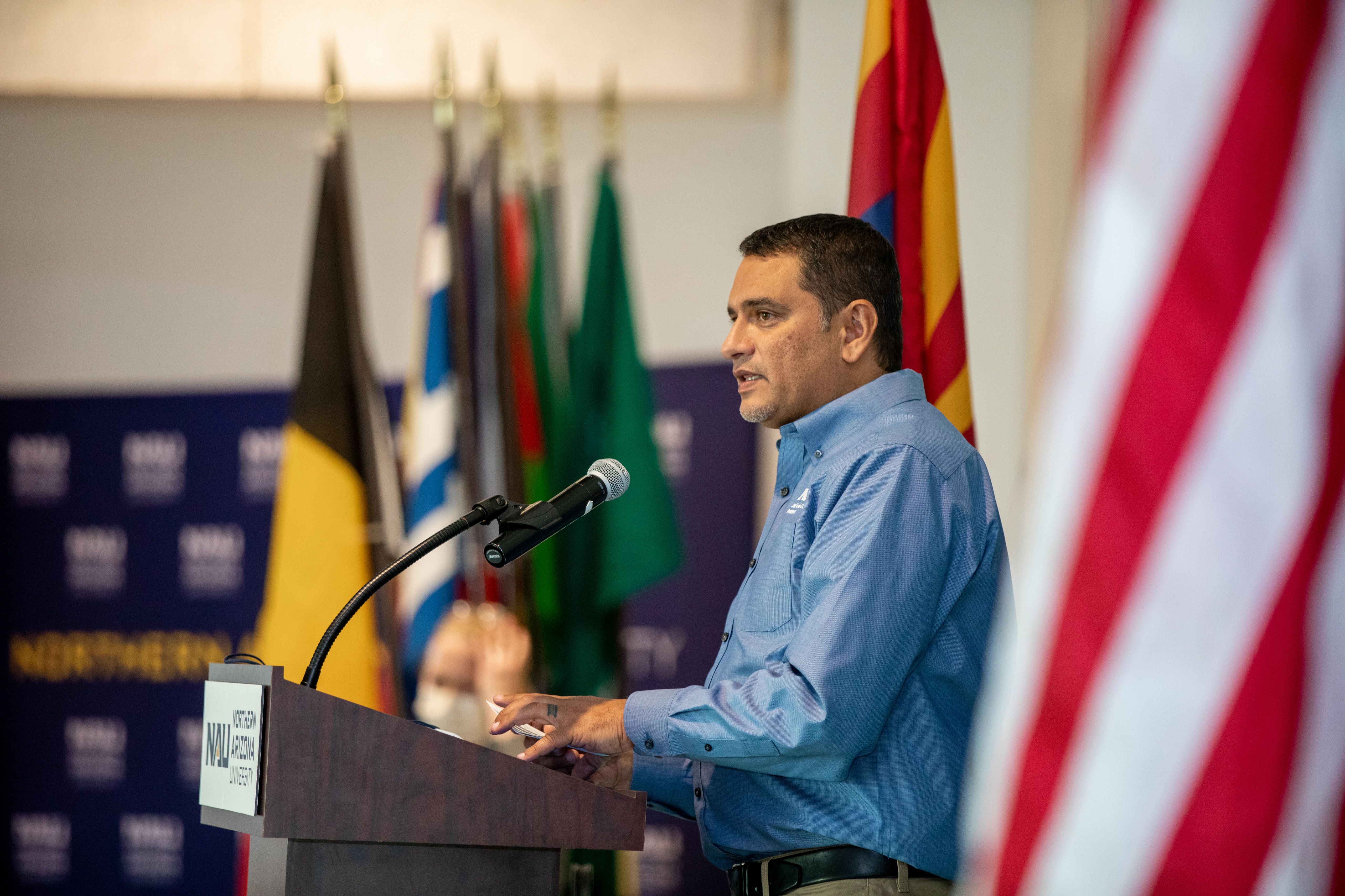 N A U president giving a speech.
