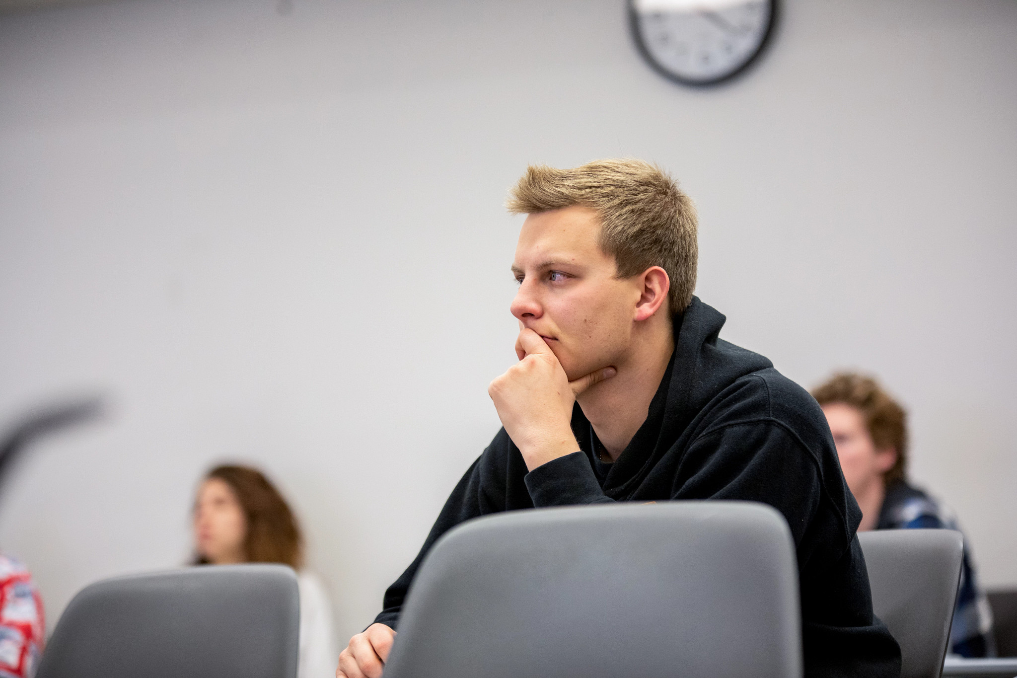 N A U student listening in class.