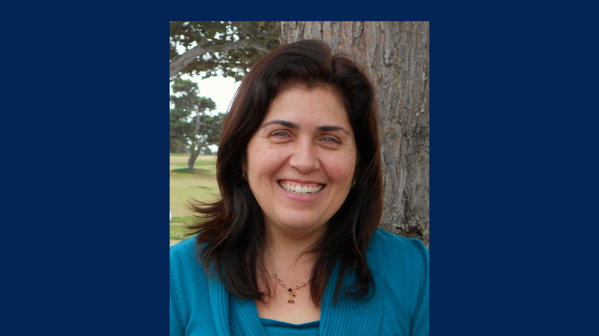 Dean for the College of Social and Behavioral Sciences, Deanne R. Pérez-Granados, smiling for a picture.