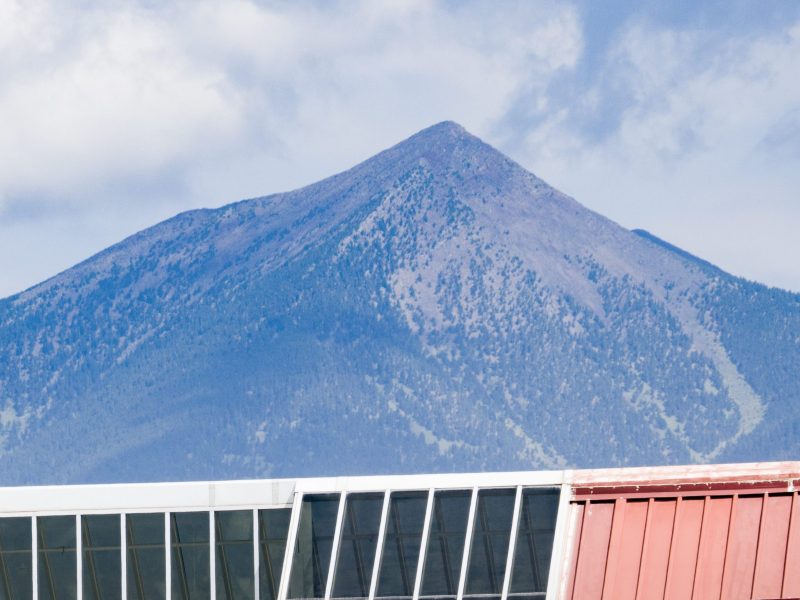 The San Francisco Peaks are seen over the Student Union.