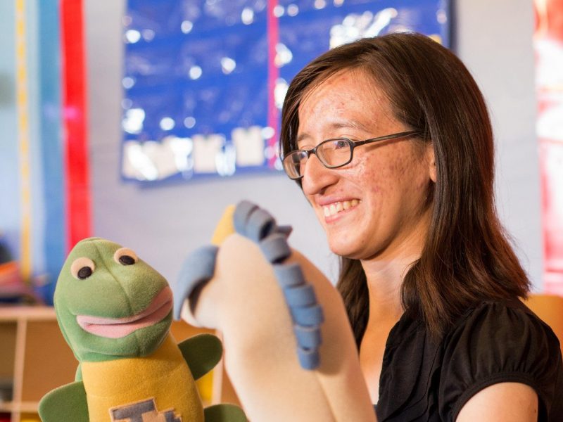 Student teacher uses puppet show to teach.