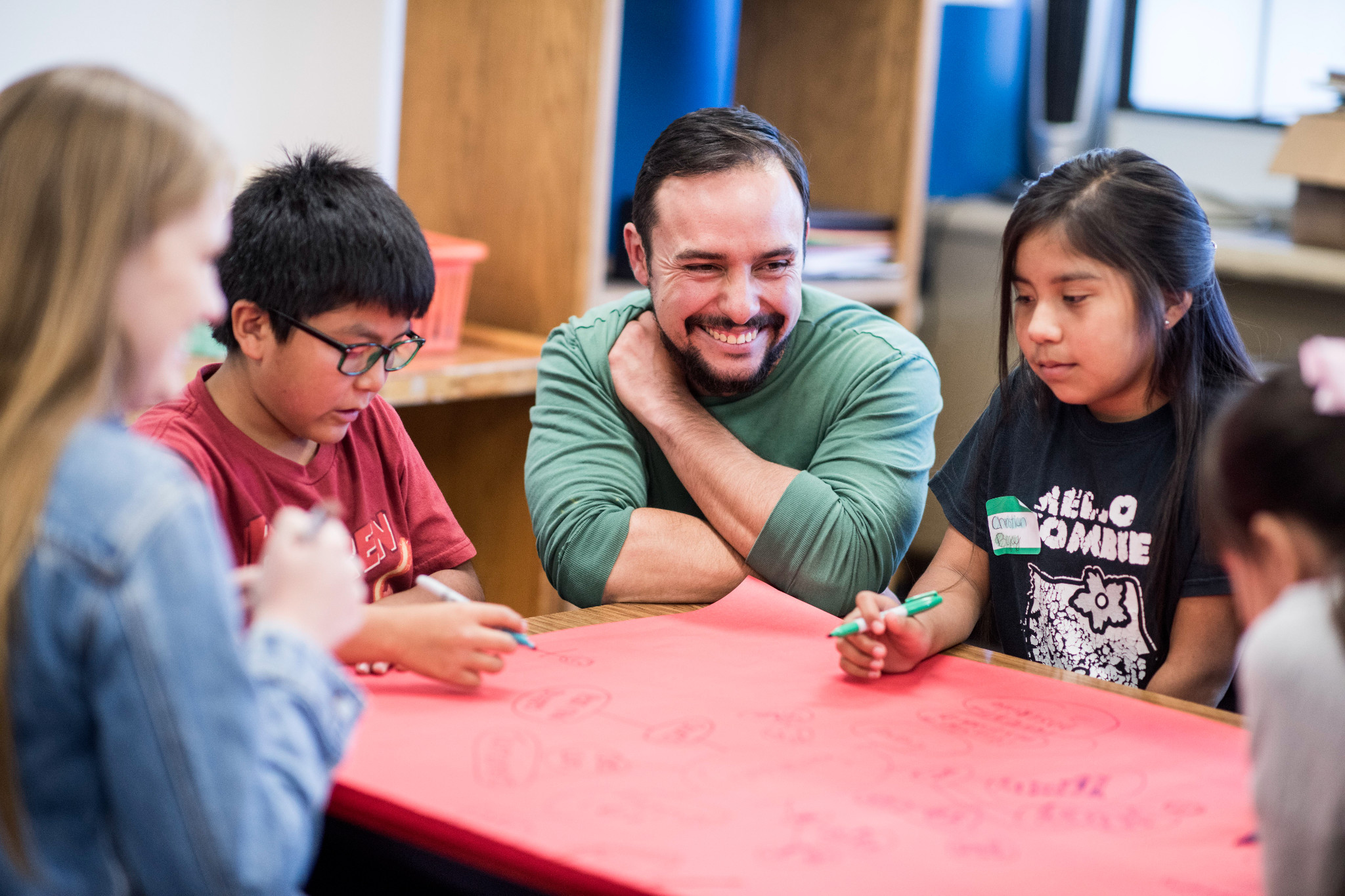 Student teacher working with young students.