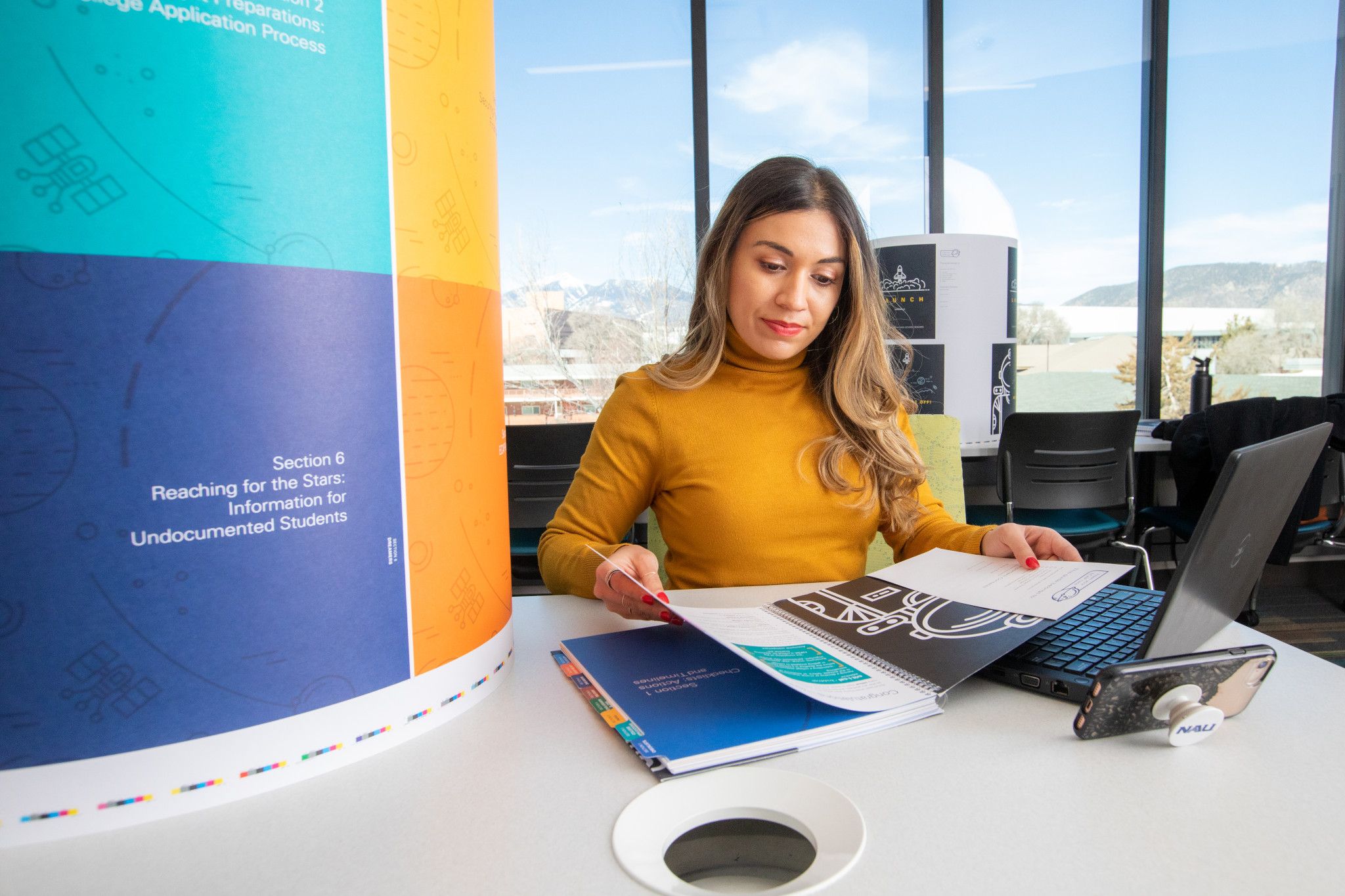 N A U student working in a lounge.