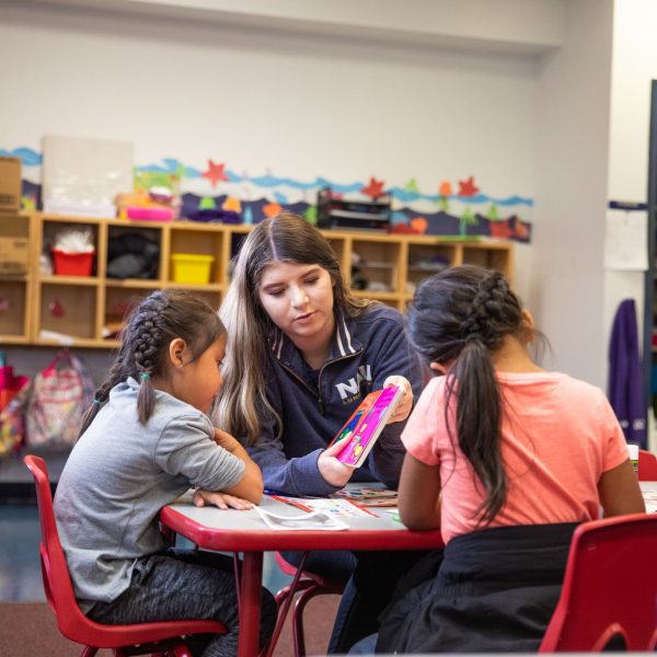 N A U student teacher reads to child.