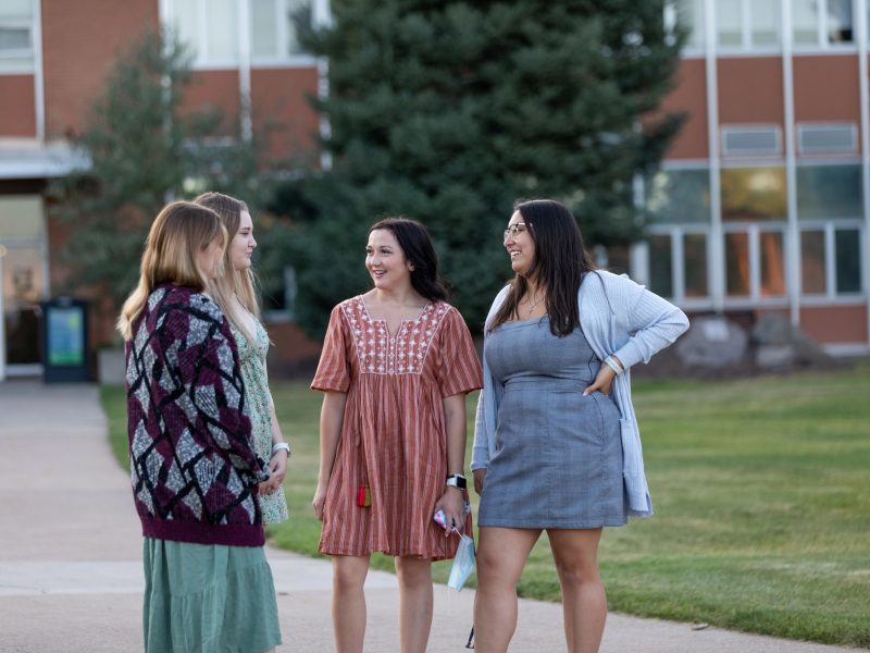 Group of N A U students talking outside.