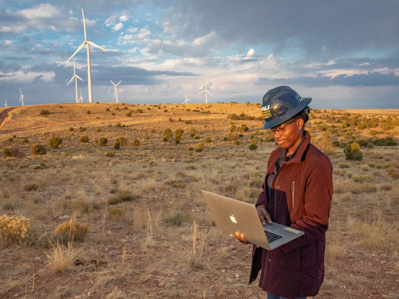 Student working at a wind farm.