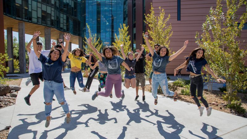 A photo of students jumping for a picture.