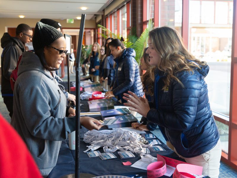 New student receives name tag on Transfer Day.