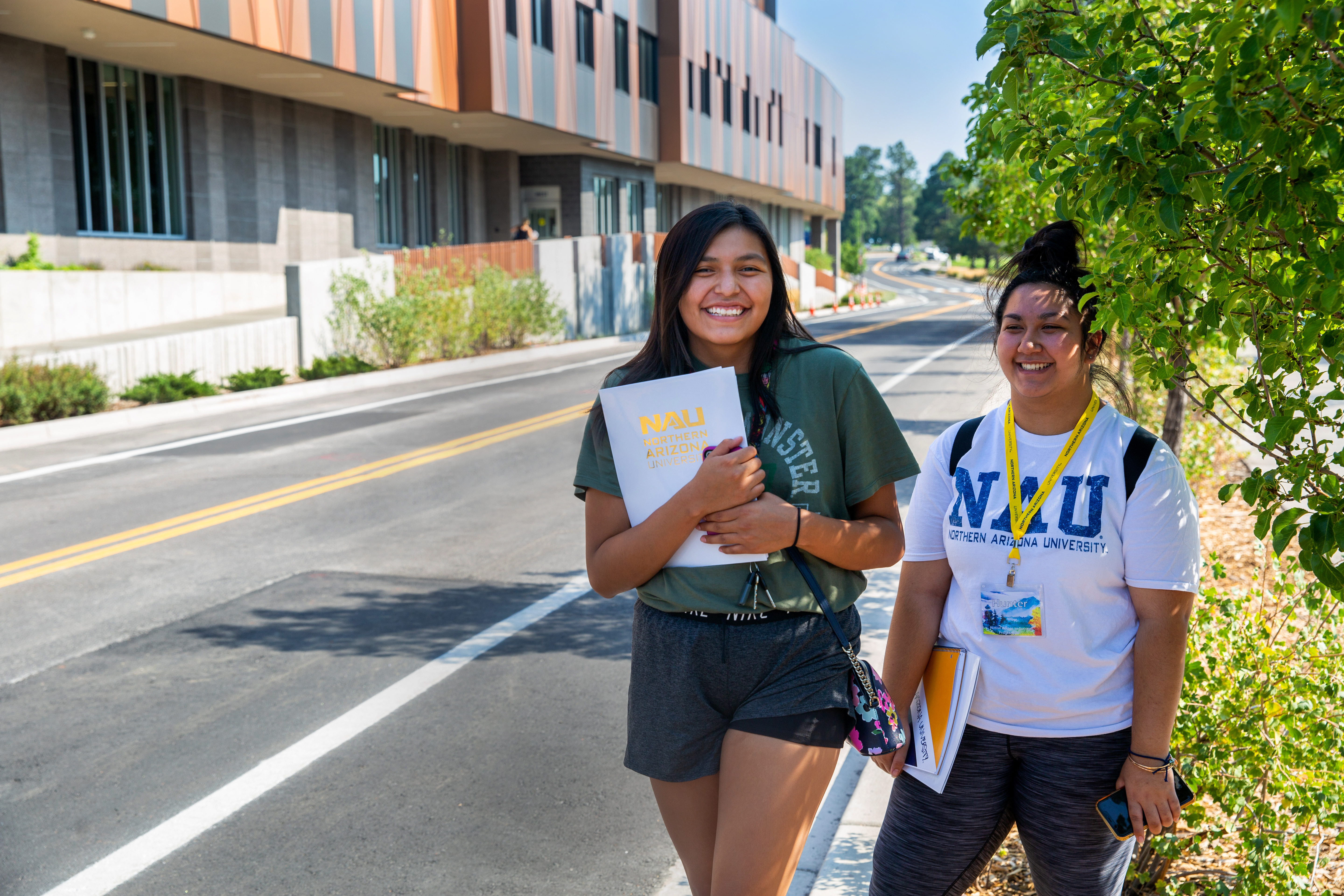 Students walk on sidewalk at N A U Flagstaff campus.