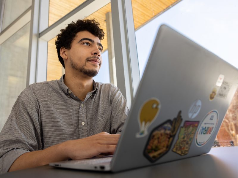A student working on a computer.