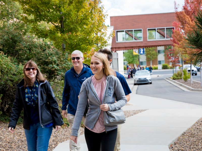 A photo of people walking on the N A U campus.