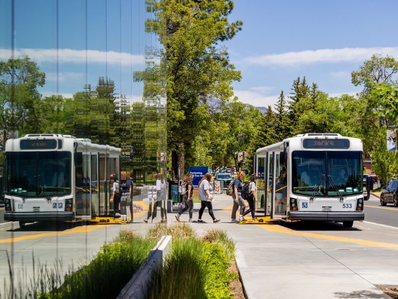 Students getting on N A U bus.