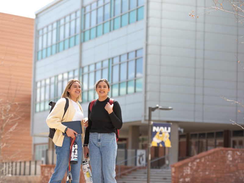 A photo of two students at the N A U campus.