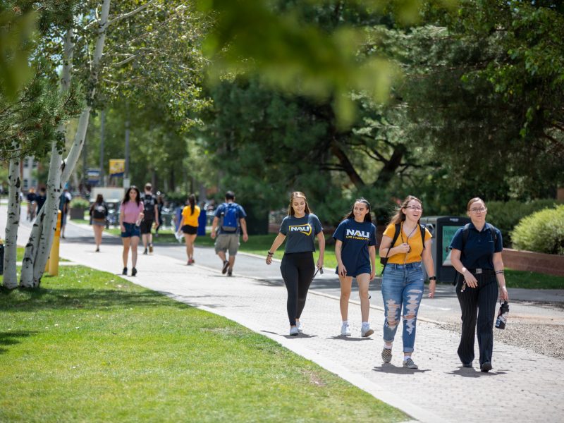 Students walking on the Pedway on a late spring day.