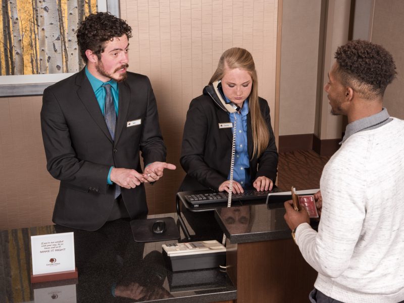 N A U students work at the Double Tree Hotel front desk.