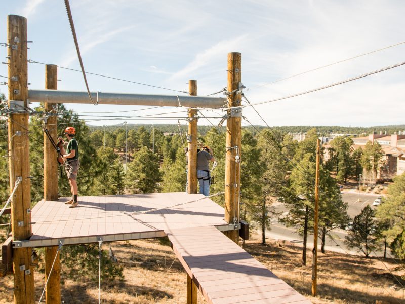 Students participating in the outdoor Campus Recreation Challenge Course.
