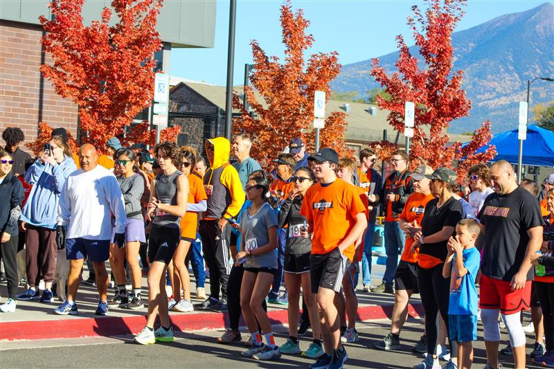 Families gathered at the start of a run ready to go.