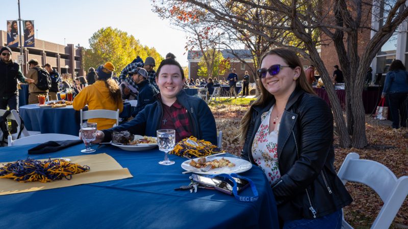 Faculty members sitting at a table together.