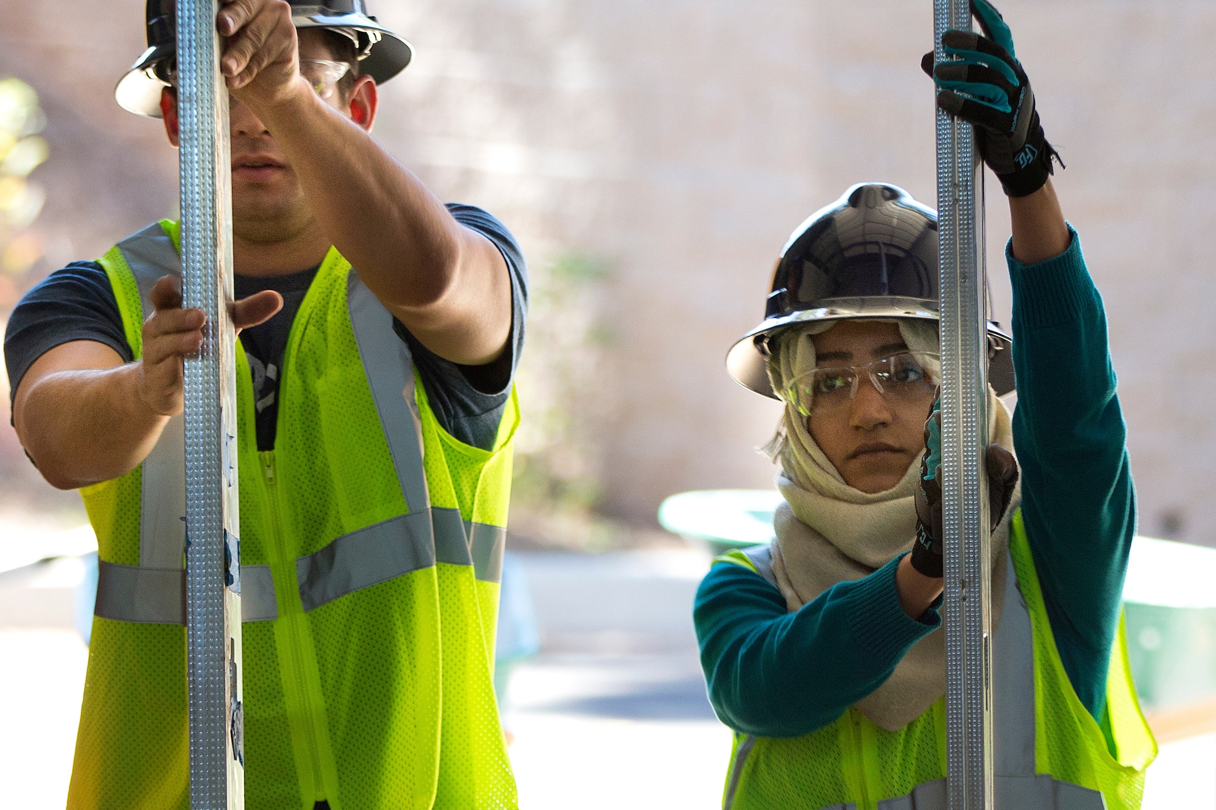 Students working together on construction.