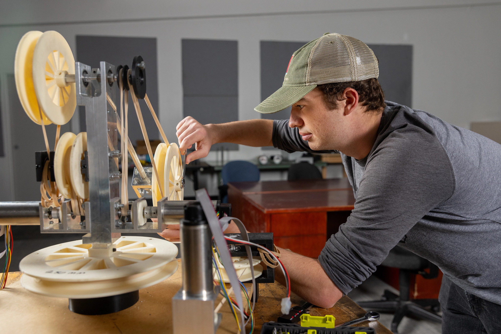 Student working on a pulley mechanism.