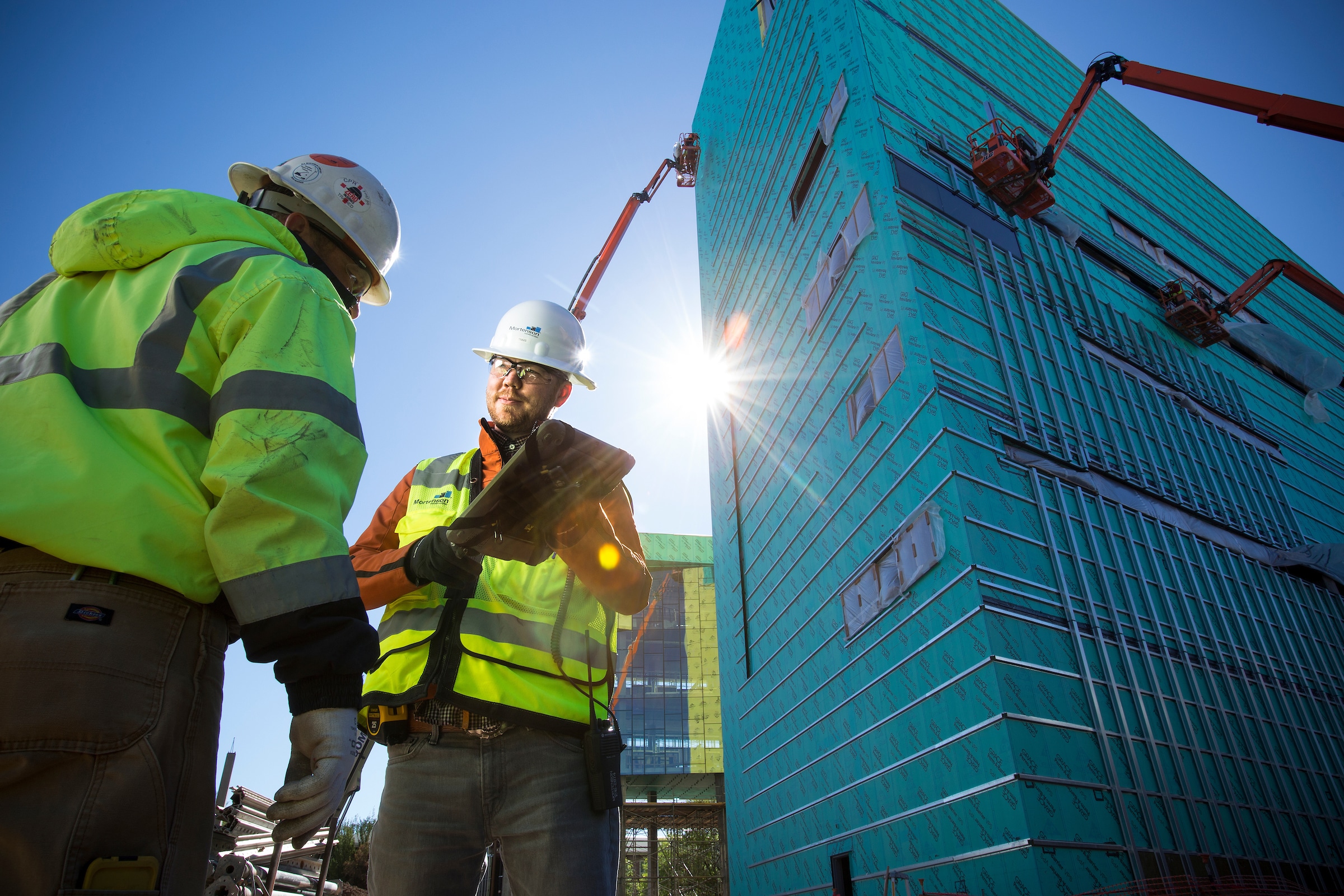 Two students on a construction site.