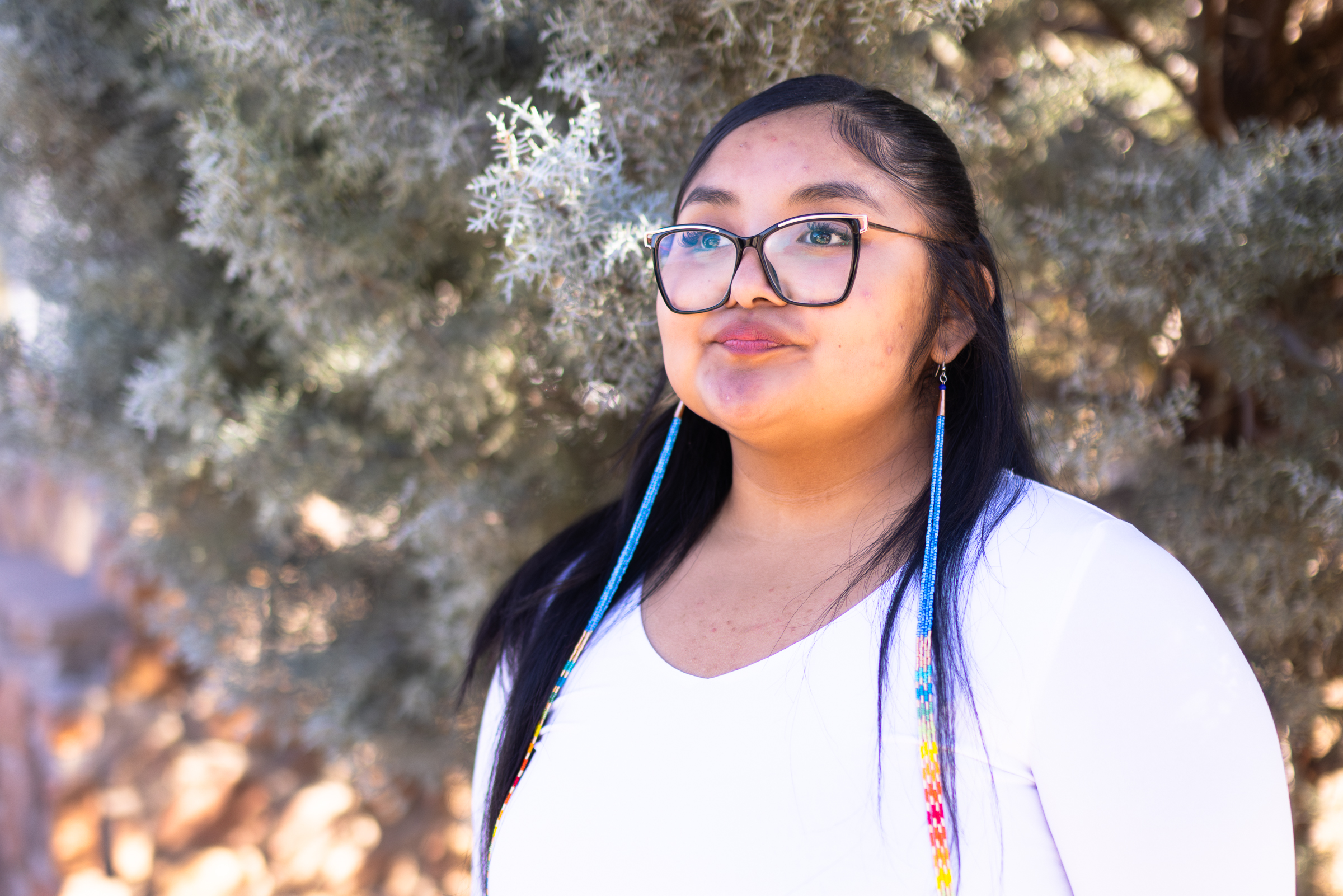 A student poses for an outdoor image