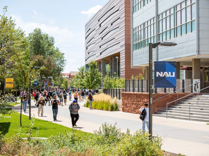 Students walking on the N A U pedway by the Health Sciences and Science Lab buildings.