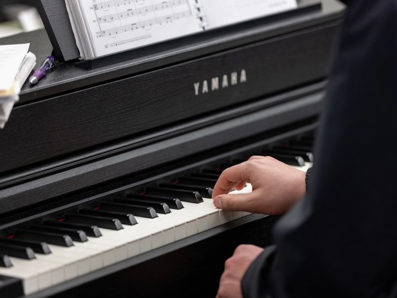 Person playing a piano.