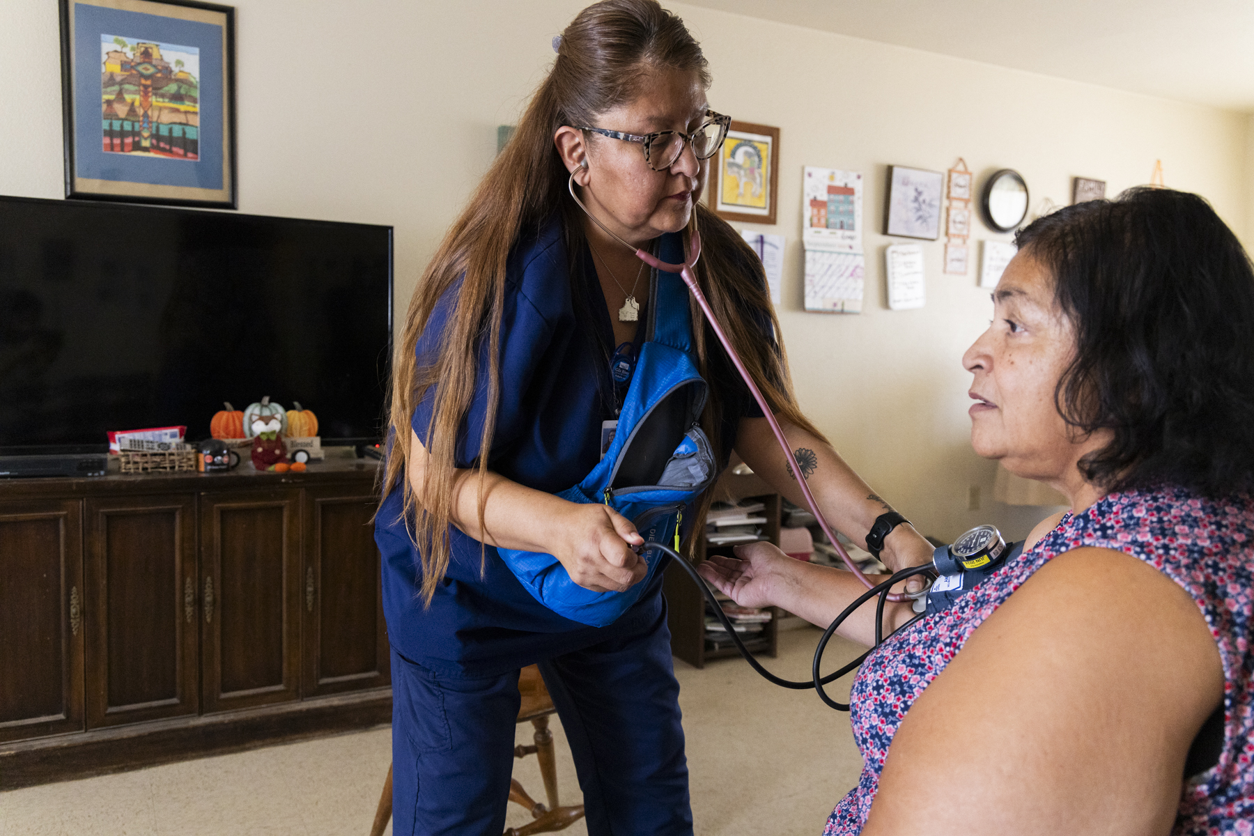 A CHR takes a patient's vital signs