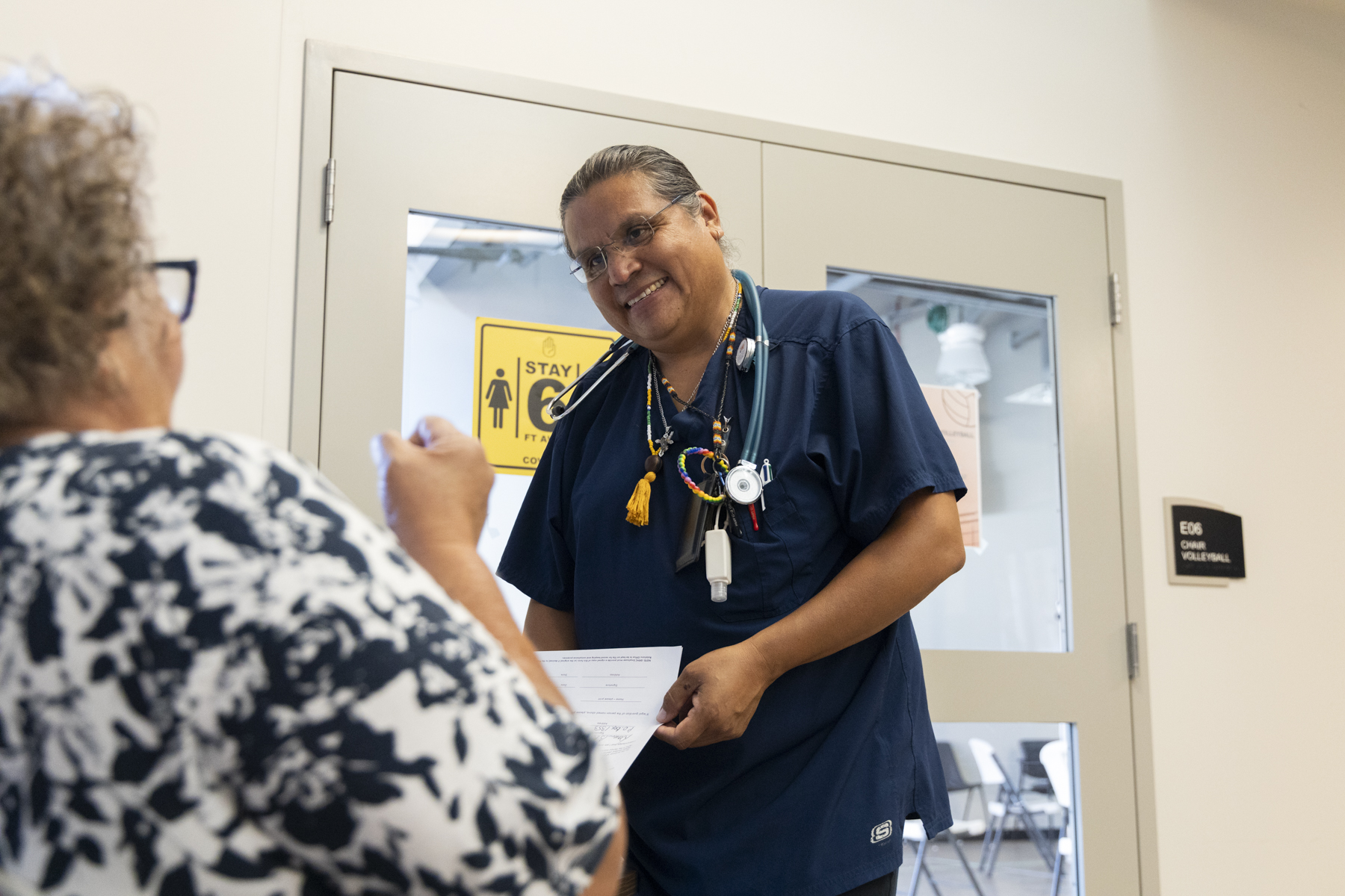 a CHR works with a patient on paperwork