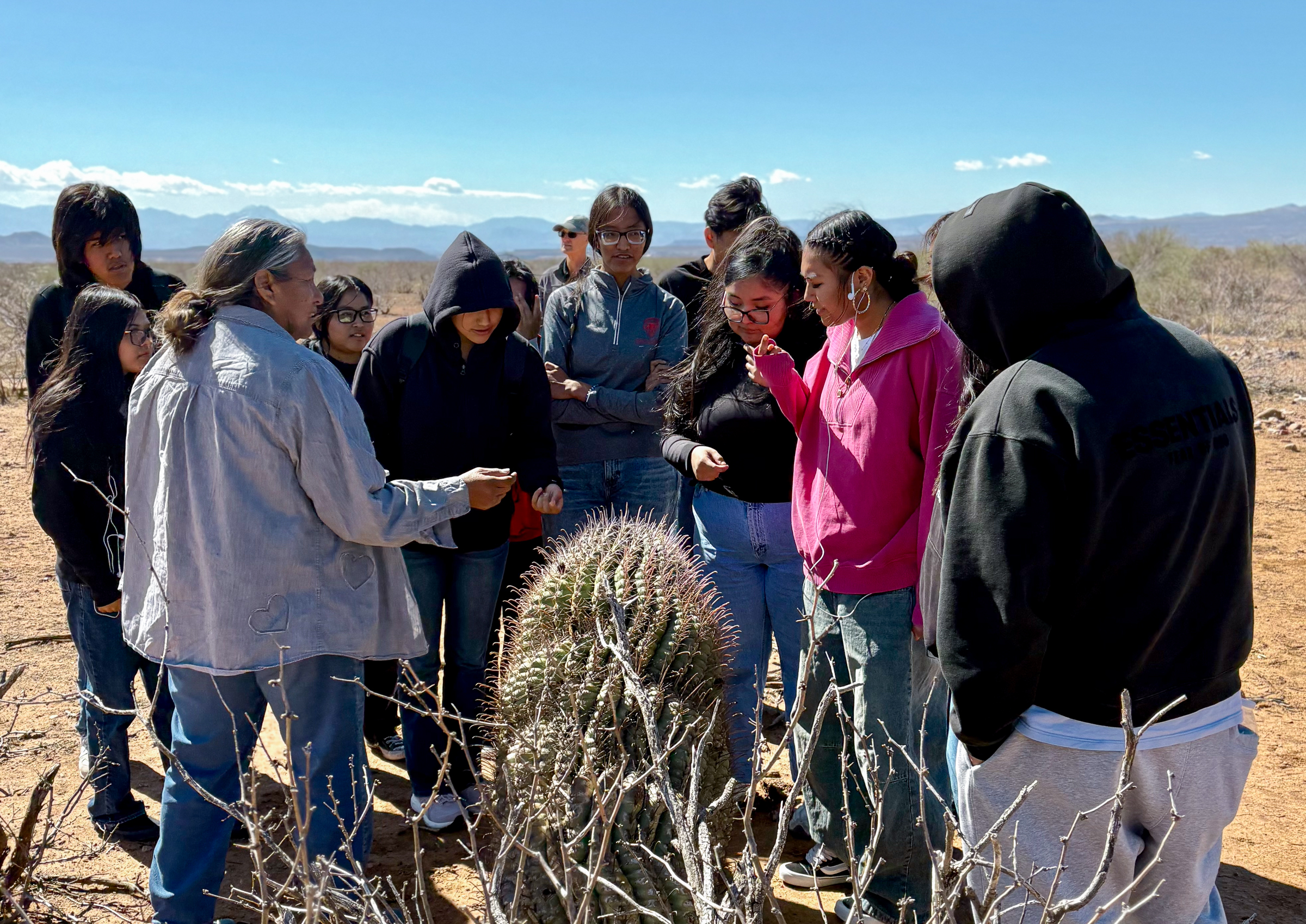 Twila Cassadore with students on a foraging walk on San Carlos Apache Tribal lands. 