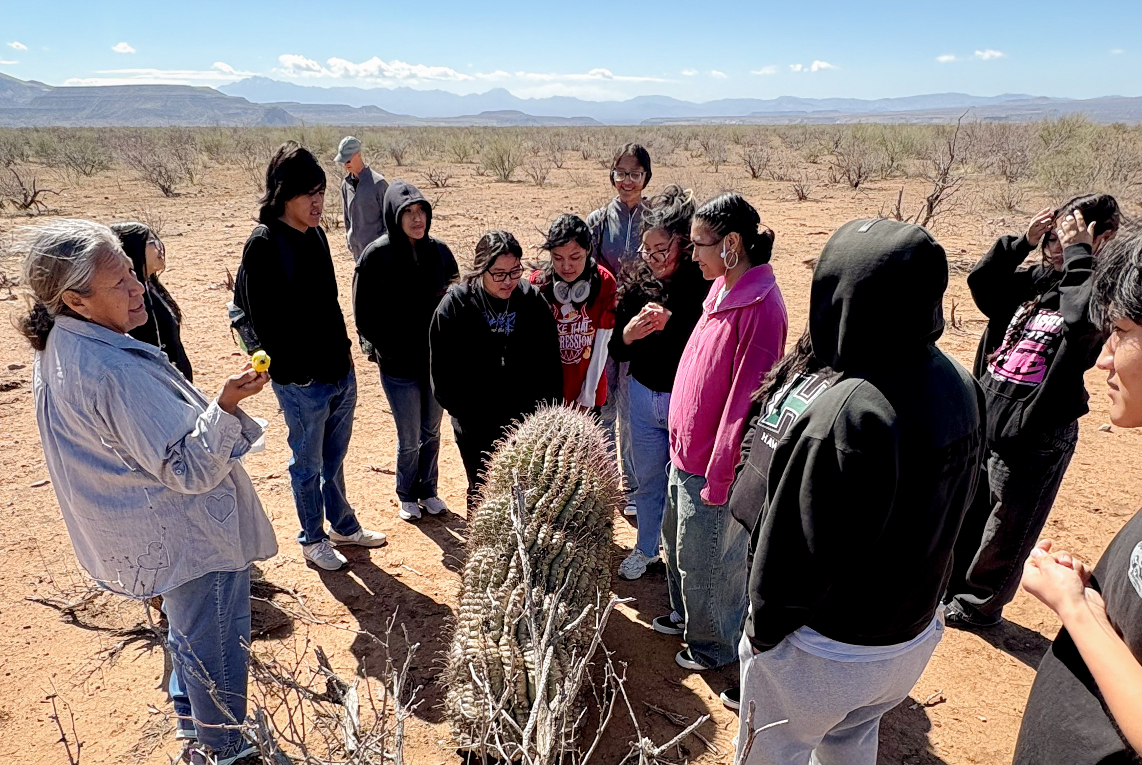 Twila Cassadore with students on a foraging walk on San Carlos Apache Tribal lands. 
