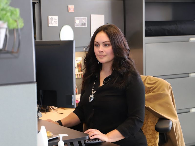 Melinda Smith working at her desk.