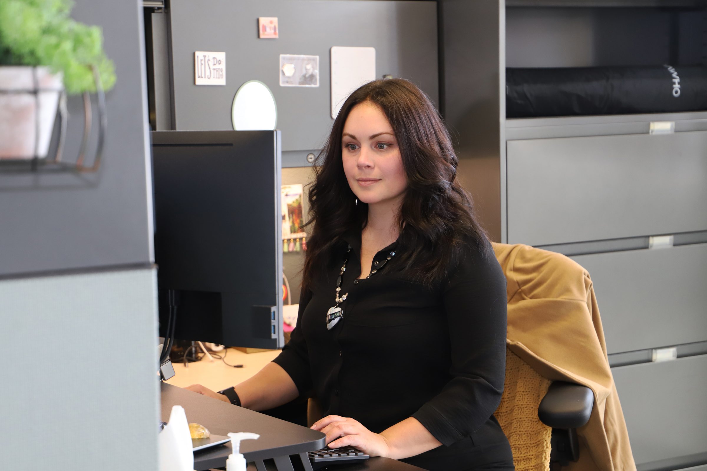 Melinda Smith working at her desk at the Center for Community Health and Engaged Research. 