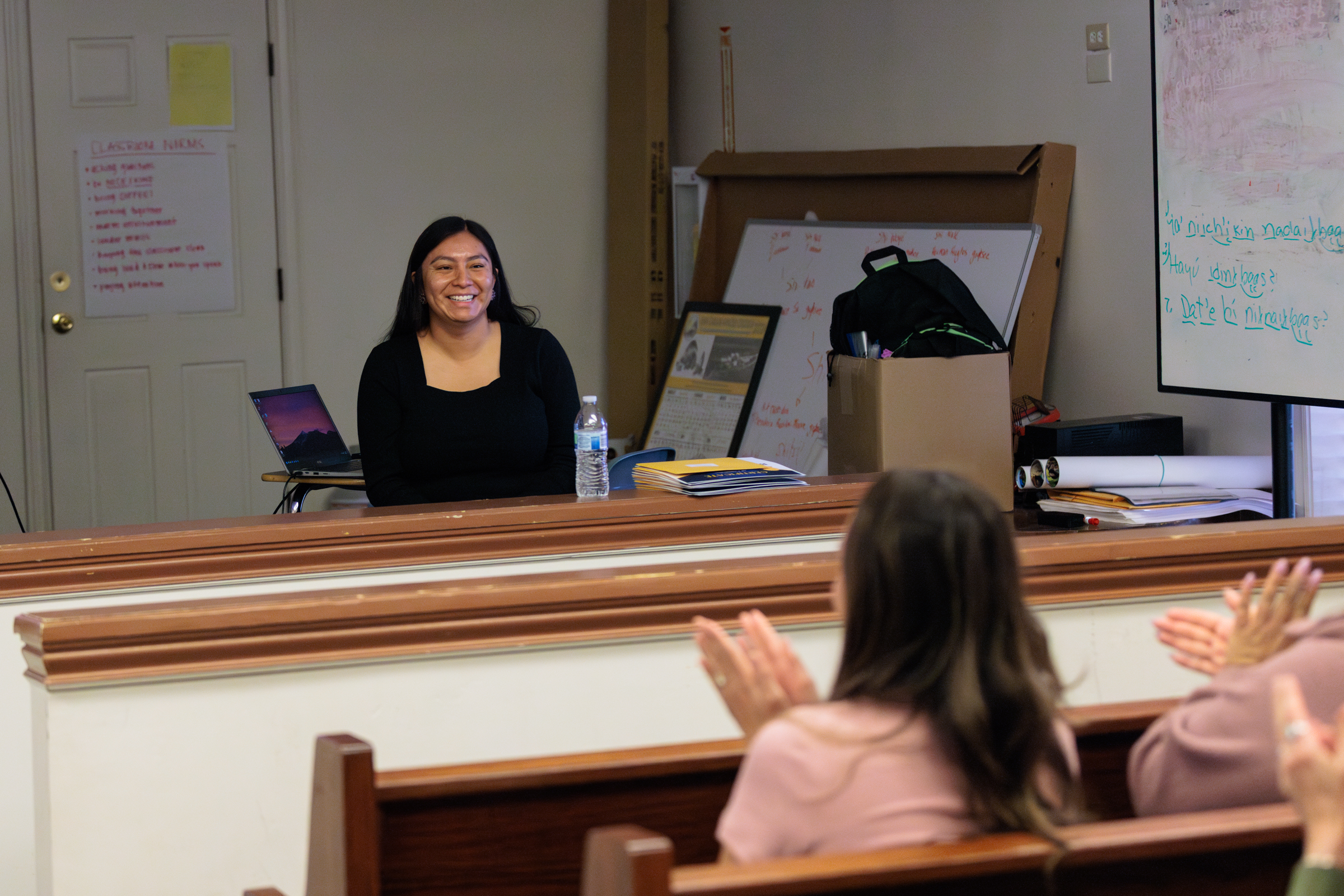 Marissa Tutt smiles as she is met with applause from the classroom audience at ISEP.