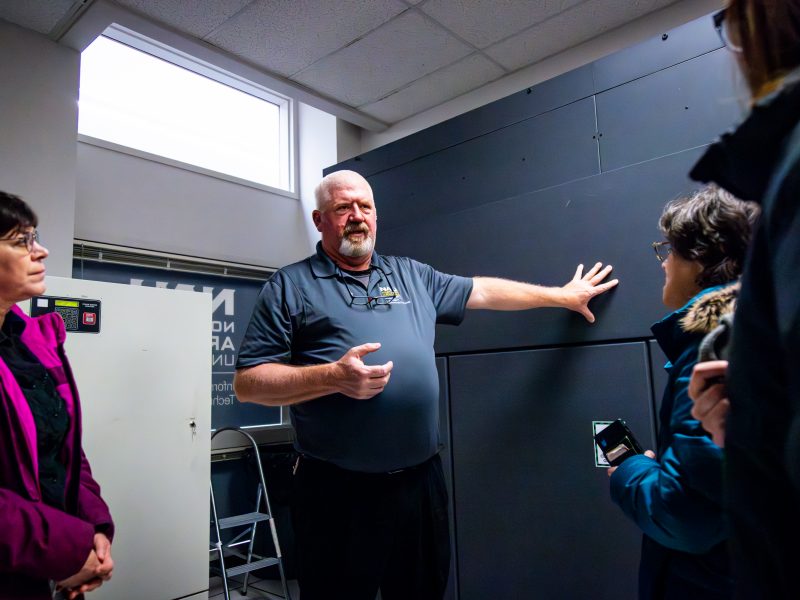 Brett West indicates the continuous batter system to SHERC