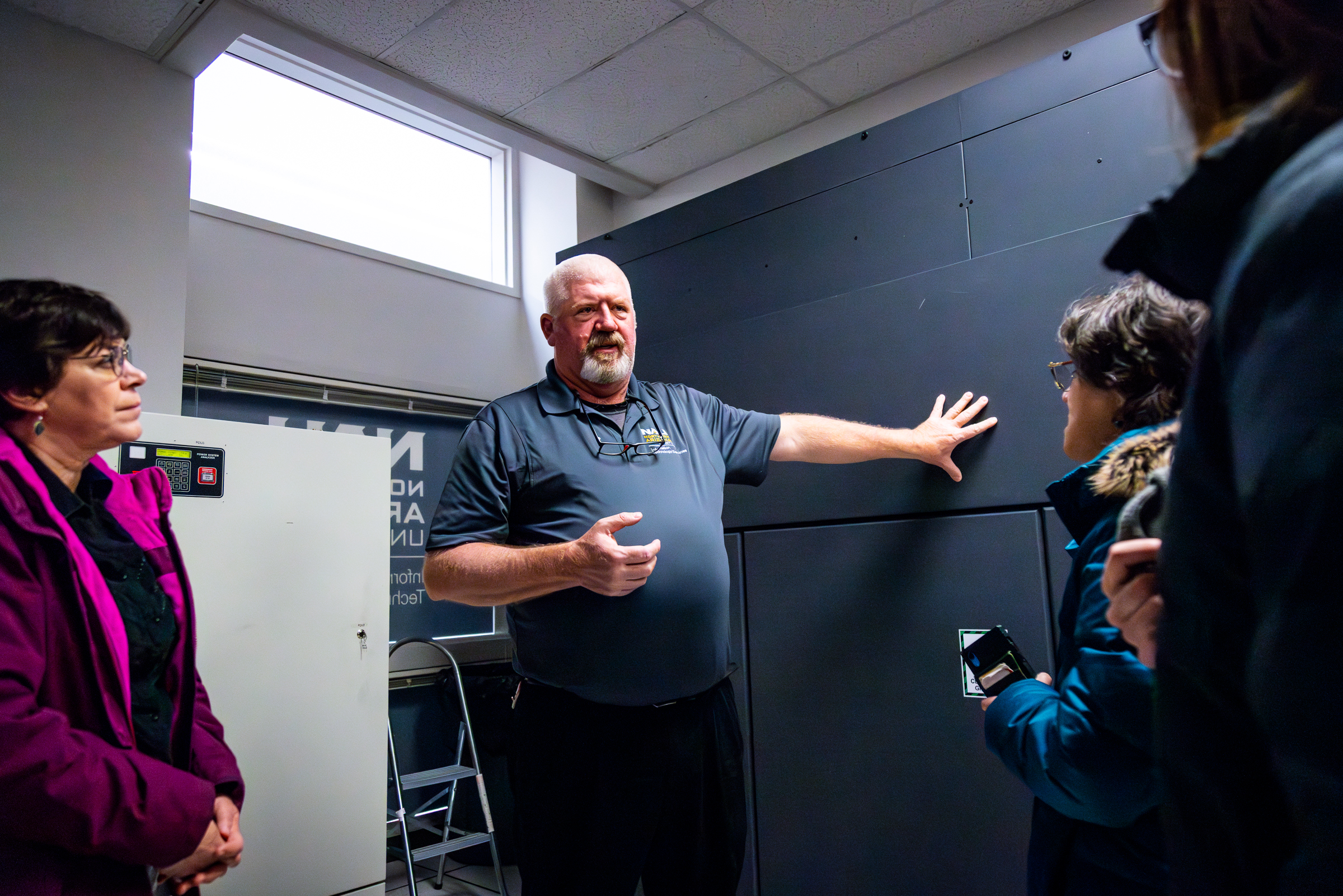 Brett West indicates the continuous batter system to SHERC
