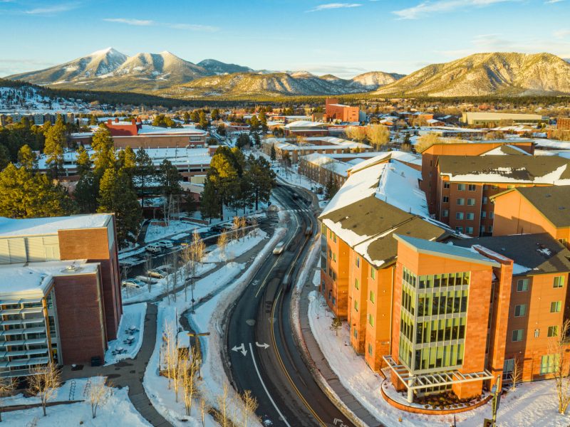 A drone photo of N A U campus in the winter.