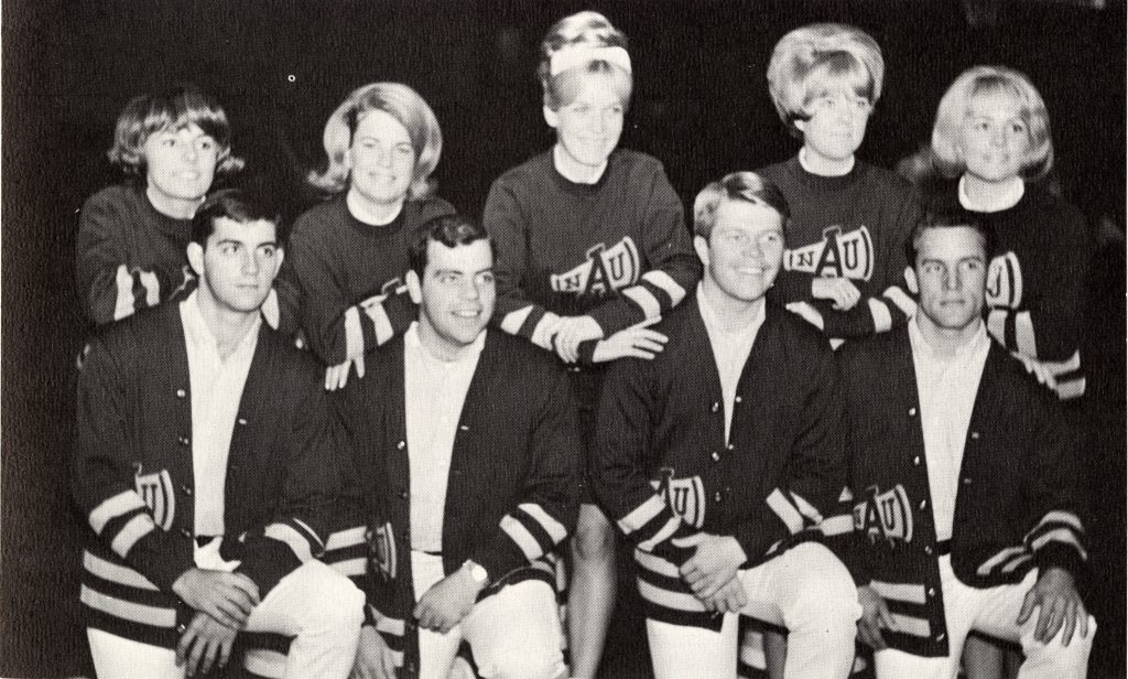 N A U's group cheerleaders wearing uniforms featuring the Megaphone symbol in the 1967.