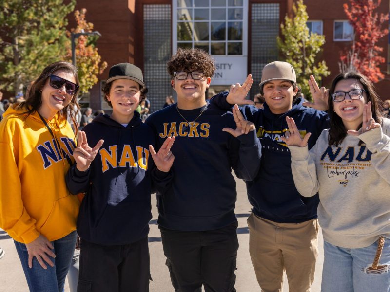 The family of a N A U freshman don their Lumberjack apparel.