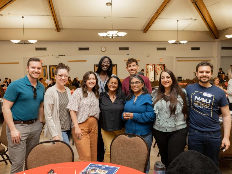 Students smile and pose at the S A C mixer.