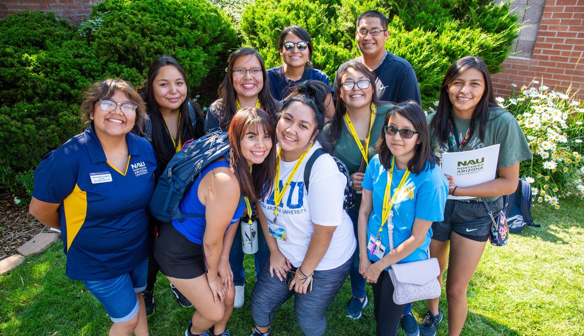 Students pose and smile for a photo at N A U.