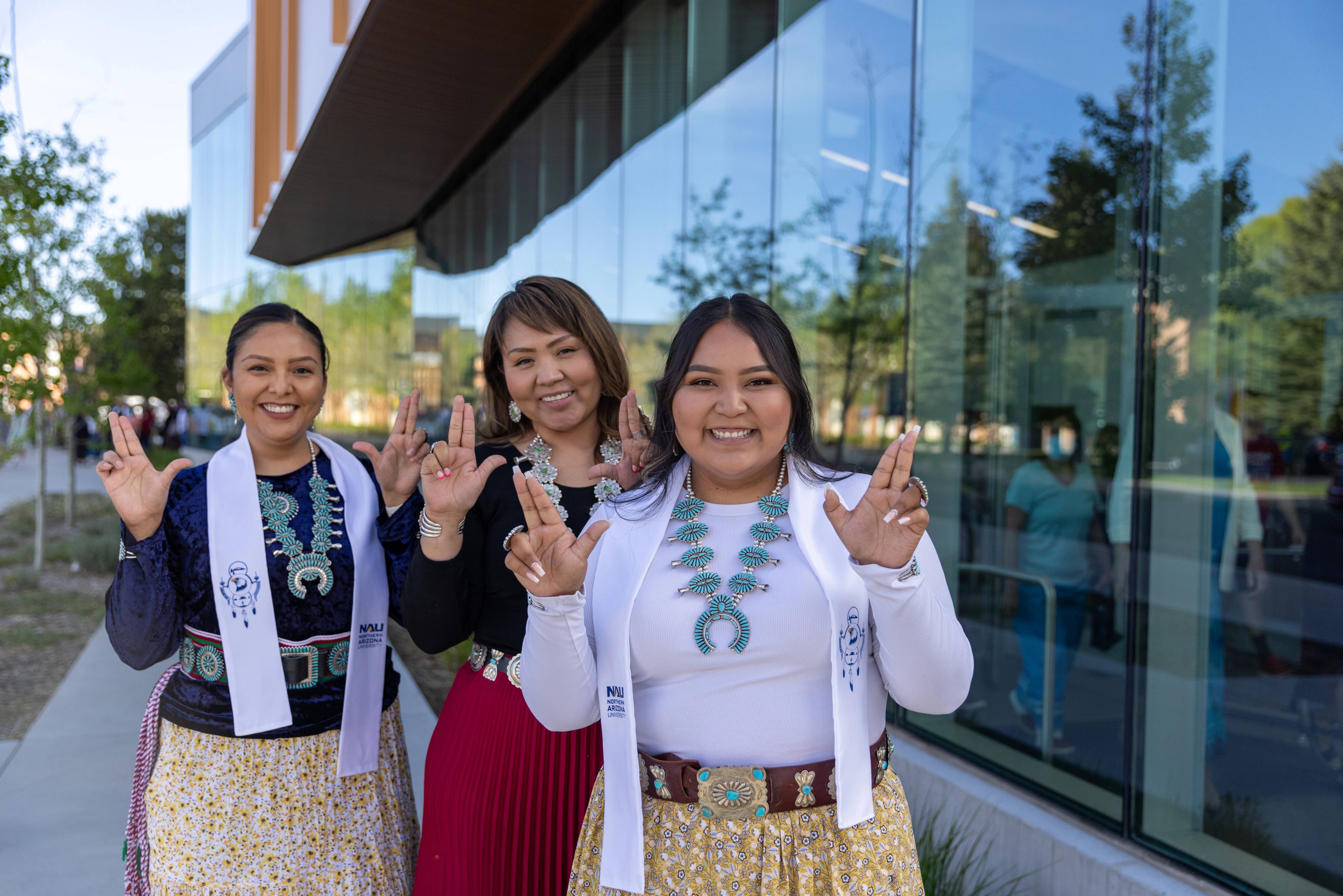 Indigenous students smiling and posing during the Indigenous convocation reception.