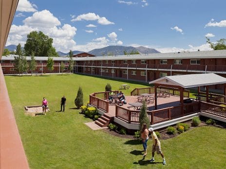 gillenwater courtyard with patio area and students walking